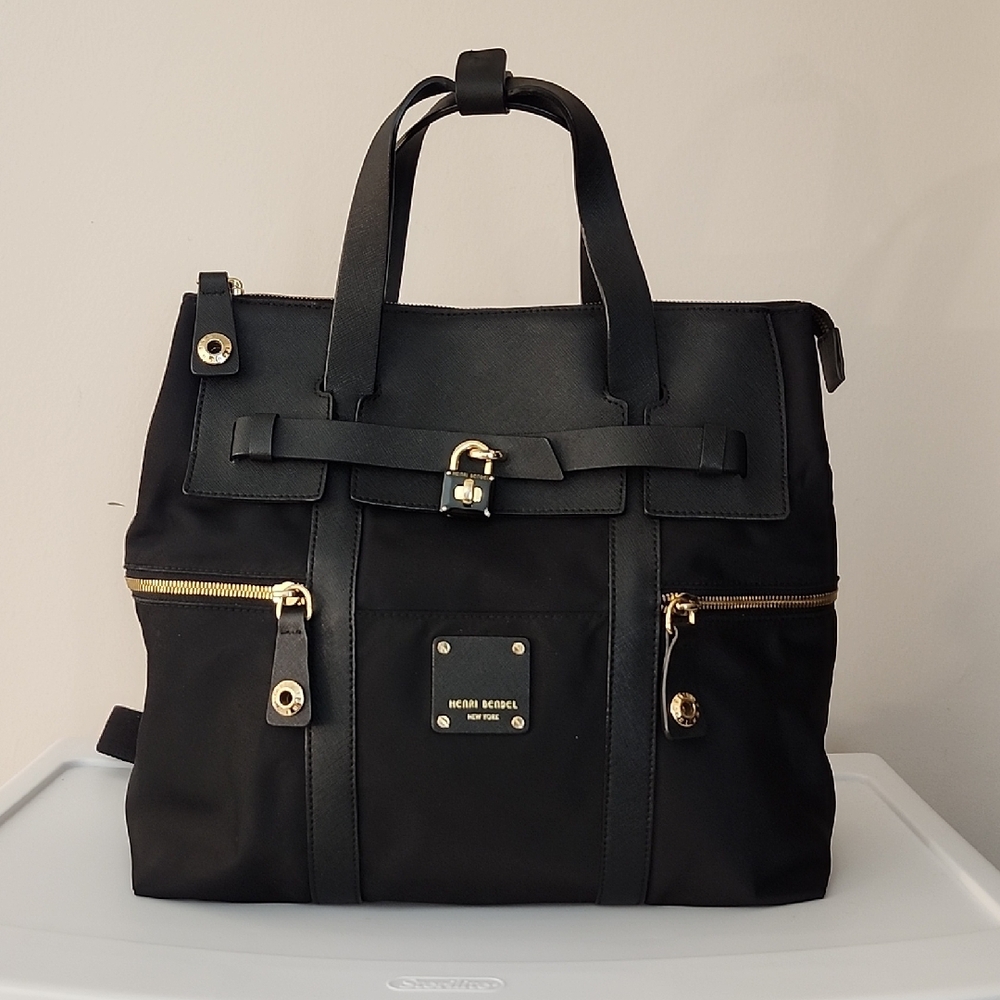 Henri Bendel Elegant Black Backpack with Gold Details